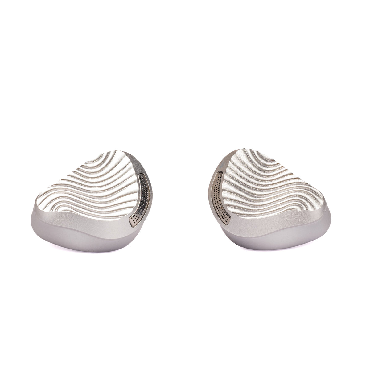 ZiiGaat x Jay's Audio Seraphim shells at an angle, brushed silver metal with a wavy faceplate pattern