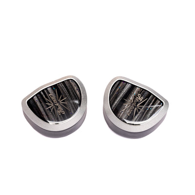 Kiwi Ears Aether shells at an angle, silver metal frames around striped faceplates with Kiwi Ears logo