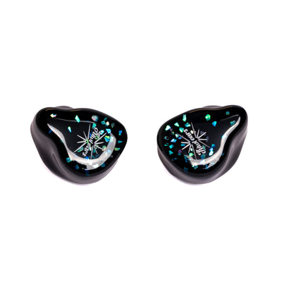 Kiwi Ears Astral shells at an angle, black resin with blue and teal flakes and a silver Kiwi Ears logo
