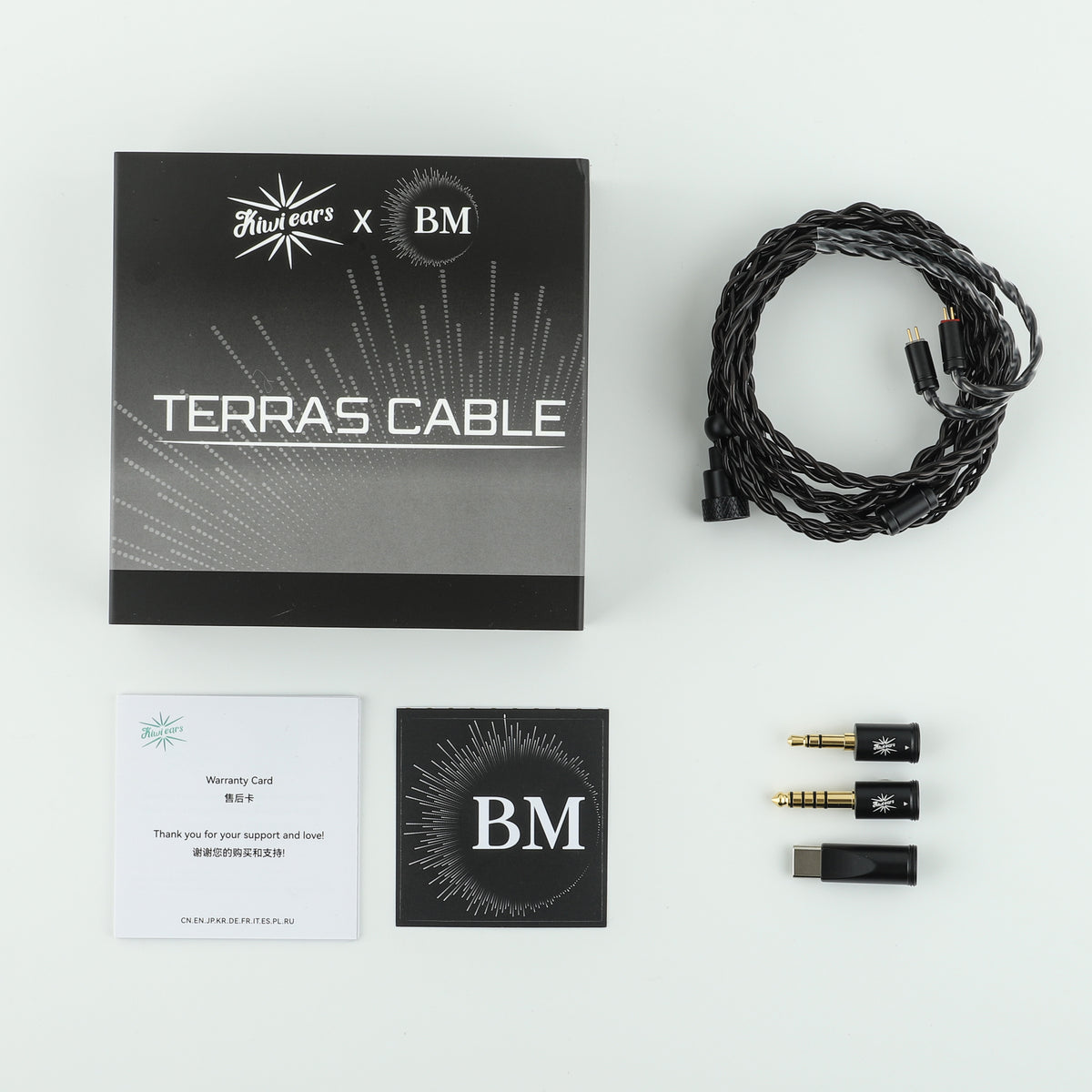 Kiwi Ears x B_Media Terras box contents: black cable, three plug modules, warranty card and B_Media card